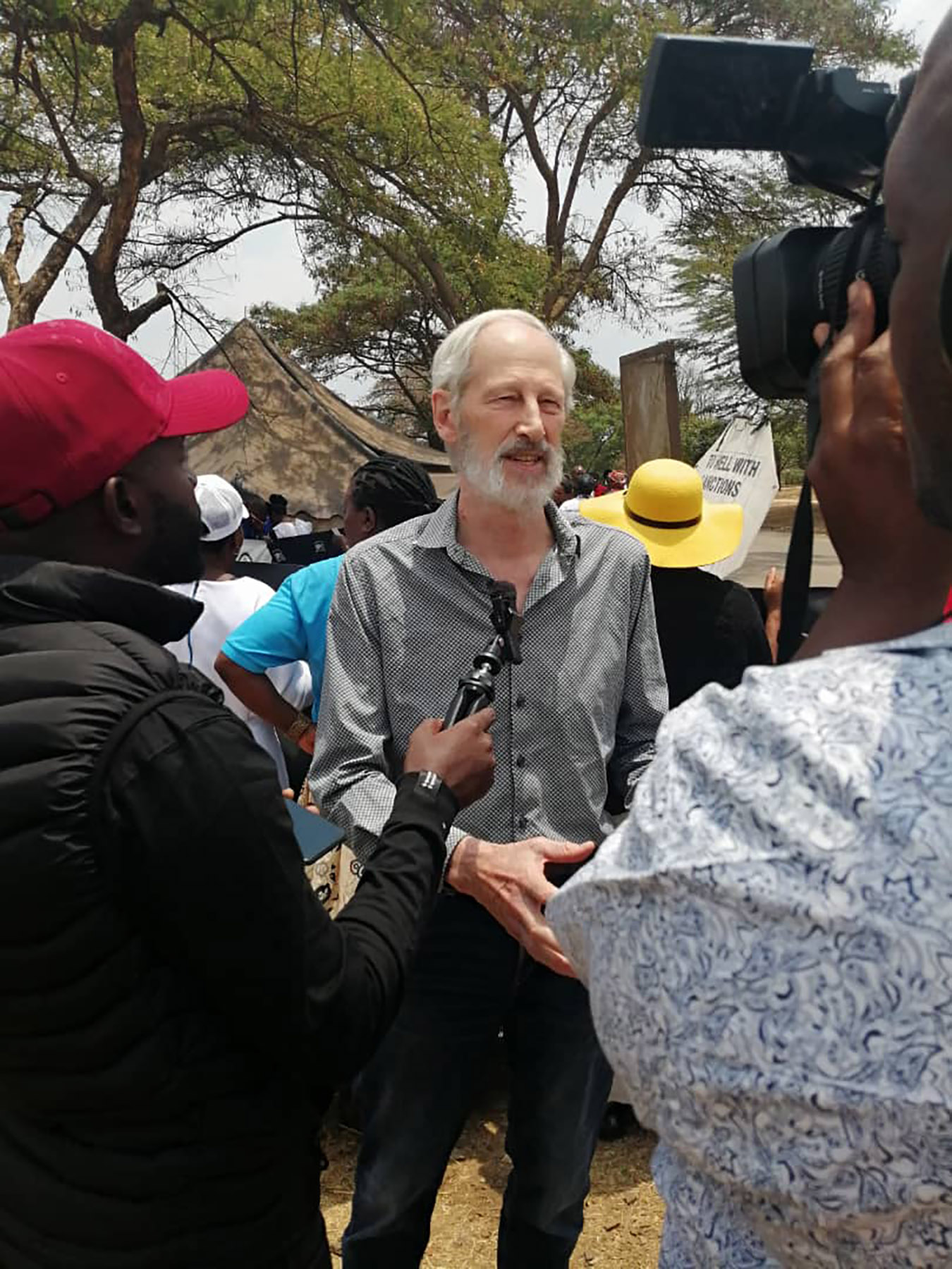 JimHolland speaks to media about the impact of sanctions on communications, tent protest opposite US Embassy, Harare, October 25, 2024.