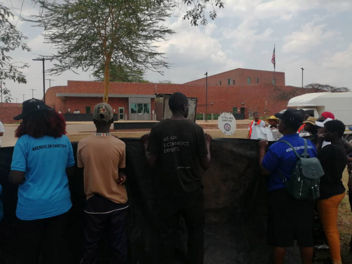 Anti-sanctins protesters face the US Embassy , Harare, October 25, 2024.