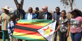 Gift of Zimbabwe flag at Western Suburbs Housing Union