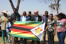 Gift of Zimbabwe flag at Western Suburbs Housing Union